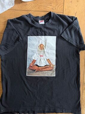 Supreme Black Tee with Meditating Figure and Red Logo